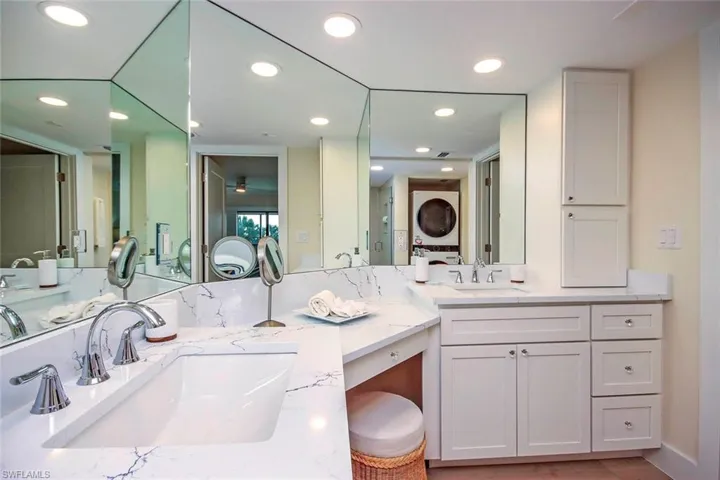 Bathroom featuring double vanity and recessed lighting