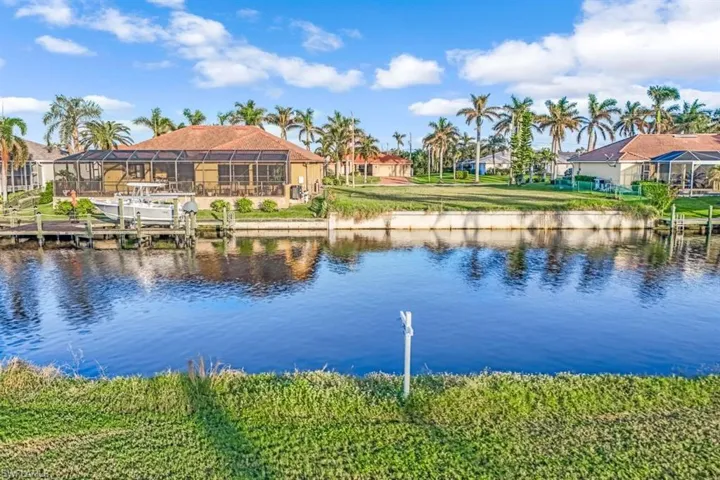 View of water feature with a dock