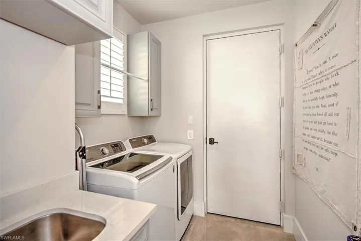 Laundry area with cabinets and washer and dryer