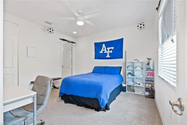 Bedroom with carpet flooring and a ceiling fan