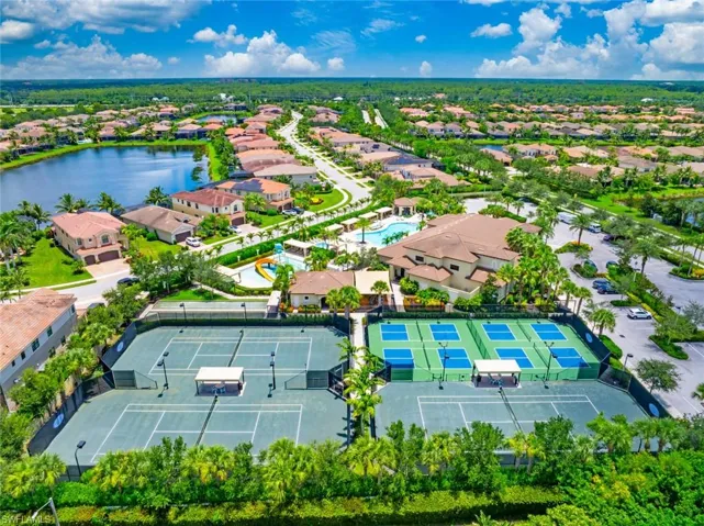 Aerial perspective of suburban area with a large body of water