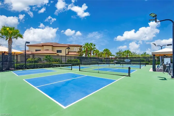 View of tennis court with community basketball court