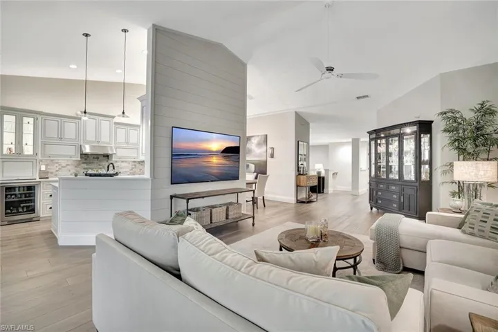 Reclaimed wood flooring, vaulted ceilings, opens to dining room, kitchen and club rooms.