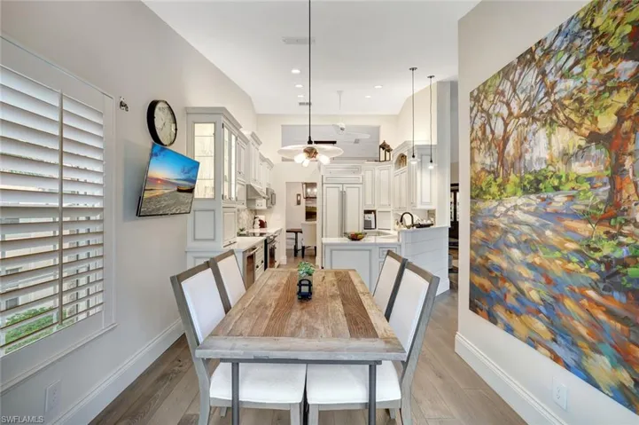 Club Room with Pecky Cypress walls, brick tile flooring. Fabulous preserve views. Vaulted shiplap/beam ceiling treatments