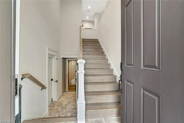 Interior entrance opens to the garage, private elevator and stairs to the main living level. Rails and treds all updated