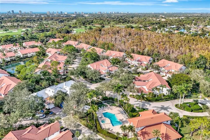 Aerial perspective of suburban area with city skyline