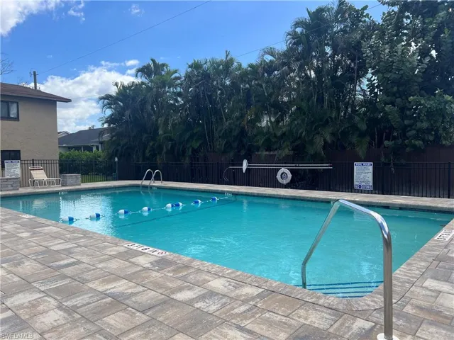 Community pool with a patio area