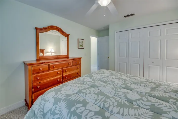 Bedroom featuring a closet and ceiling fan