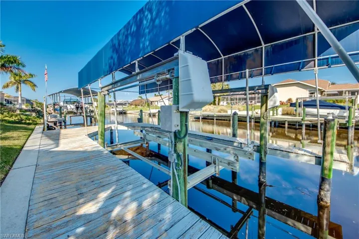 Dock area featuring a water view