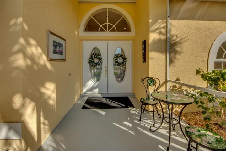 Property entrance featuring french doors