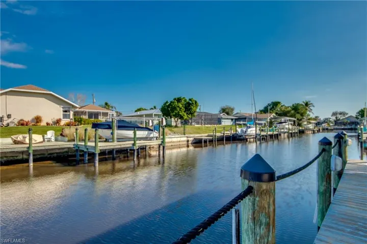 Dock area featuring a water view