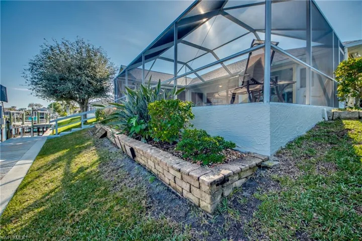 View of yard with a lanai