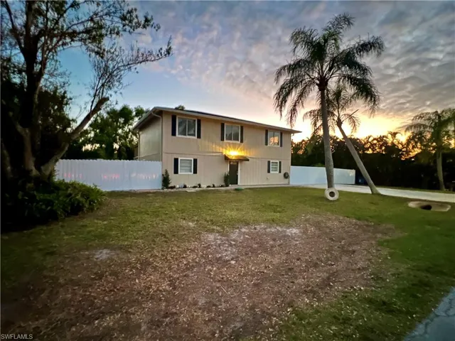 8430 Wren Rd. View of front of house with a yard