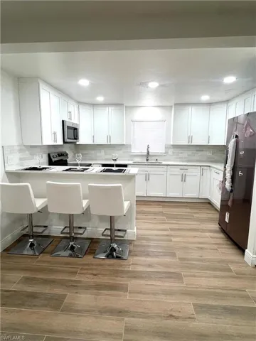 New wood cabinets, granite tops, and new stainless steel appliances.