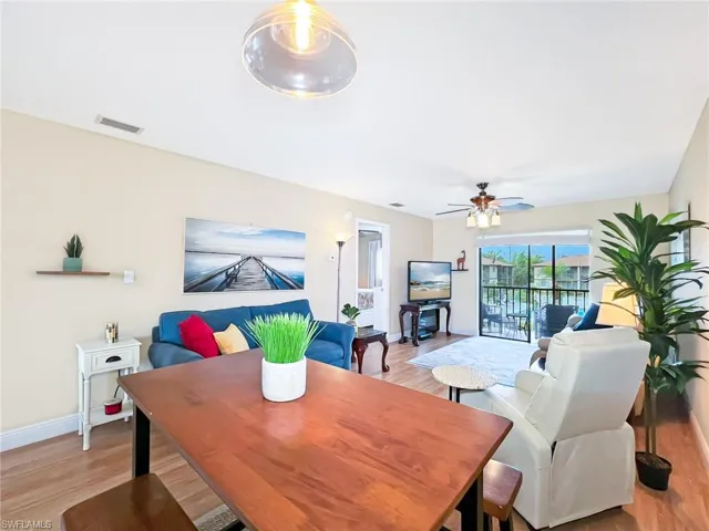 Dining area featuring light wood-type flooring and ceiling fan