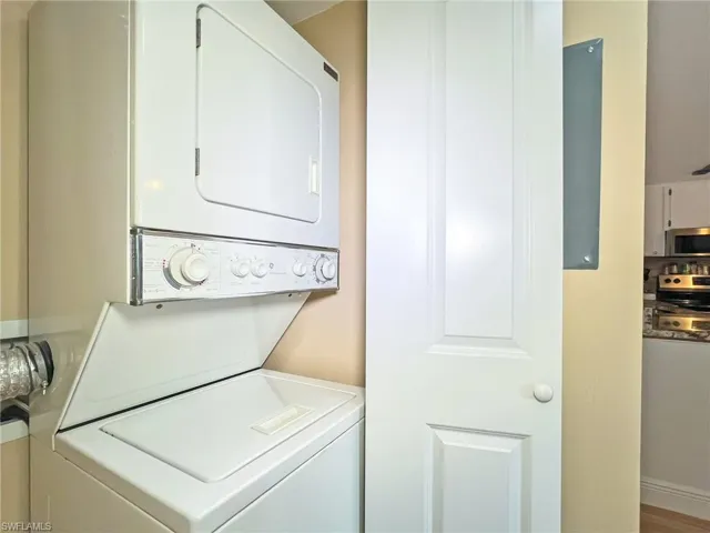 Washroom with stacked washer and dryer