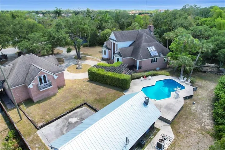 View of the Back of the 3 Car Garage, Over the Pool House & Picnic Area, Gazebo, Pool & Deck, the Circular Drive, the Dock and the Main House