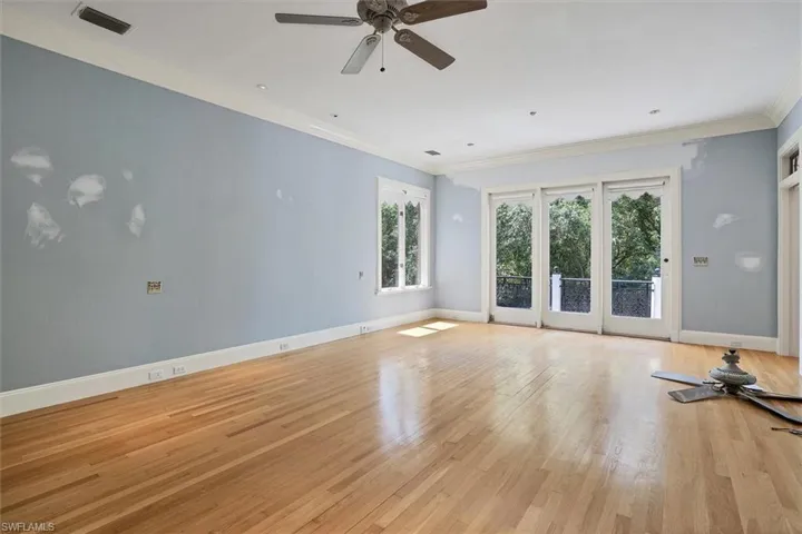 First Floor Master Bedroom with Access to the Back Balcony Overlooking the Landscaping & Water Views