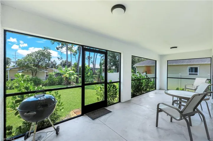 Relax on your sreened lanai with your favorite beverage.
