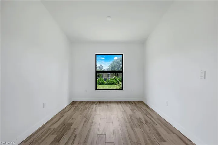 This home offers plenty of windows, allowing for natural light to shine through.