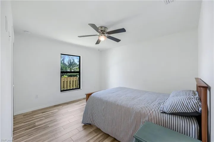 Guest bedroom located on opposite side of home from primary for maximum privacy.