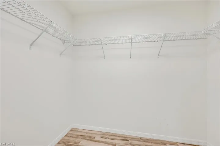 Large walk-in closet with plenty of space for both of you.