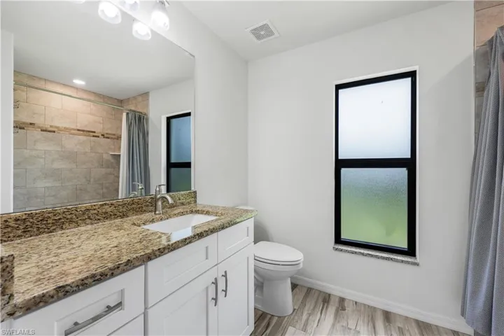 Guest bathroom with plenty of storage.