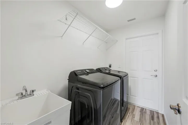 Laundry room with laundry tub.