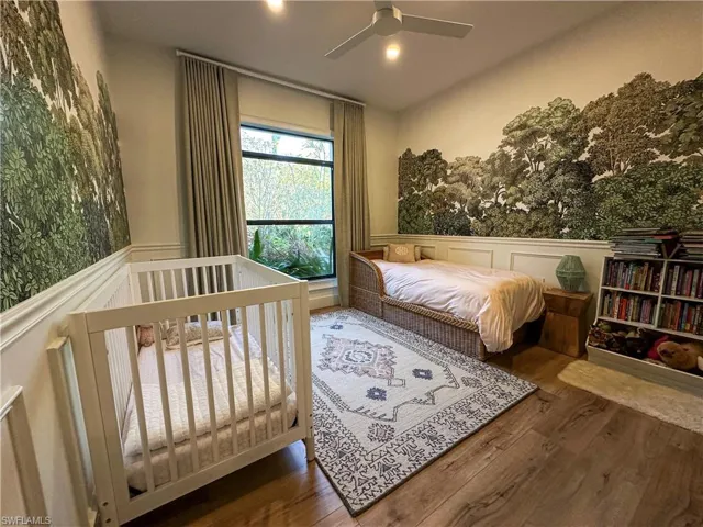 Bedroom with wood-type flooring and ceiling fan
