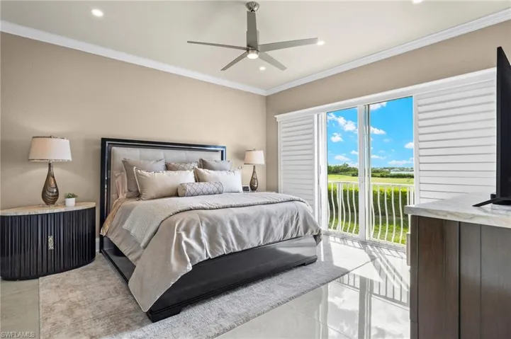 Bedroom with crown molding, light tile patterned floors, ceiling fan, and access to exterior