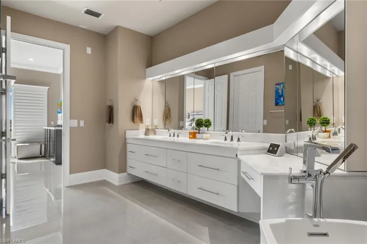 Bathroom featuring vanity and tile patterned flooring