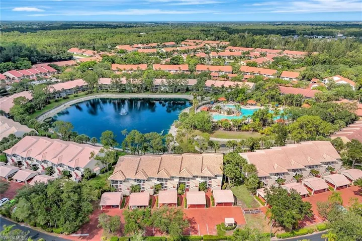 Aerial view of residential area featuring a large body of water