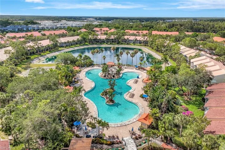 Aerial view of residential area featuring a large body of water