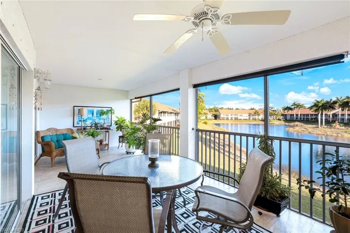 Sunroom / solarium with a water view