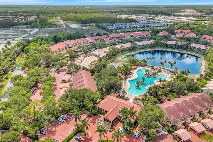 Aerial perspective of suburban area with a large body of water