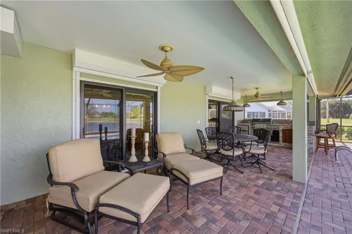 View of patio and outdoor kitchen / dining area
