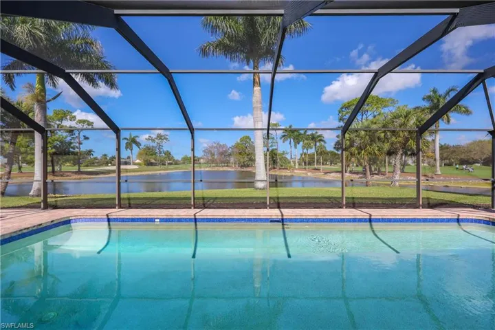 Swimming pool with water view.