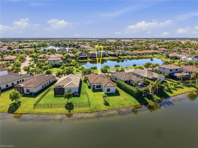 Aerial view of residential area with a nearby body of water