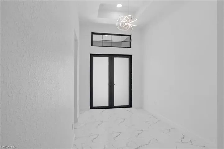 Doorway to property featuring french doors