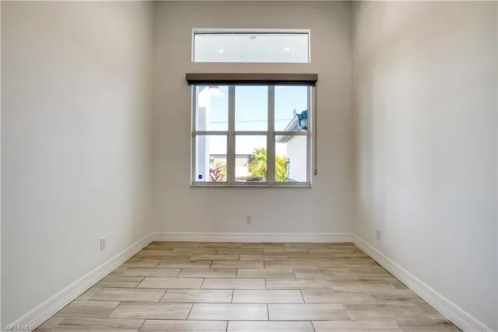 Empty room featuring wood tiled floors