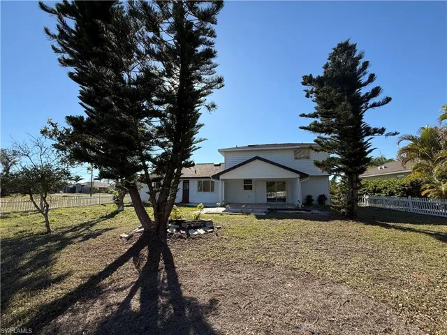 View of yard featuring covered porch