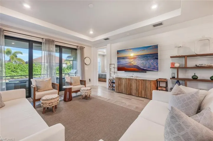 Living room featuring a tray ceiling