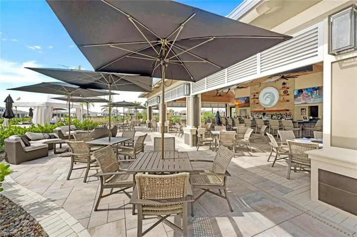 View of patio featuring ceiling fan