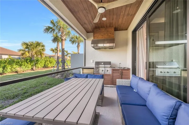 Balcony featuring ceiling fan, outdoor lounge area, grilling area, and area for grilling