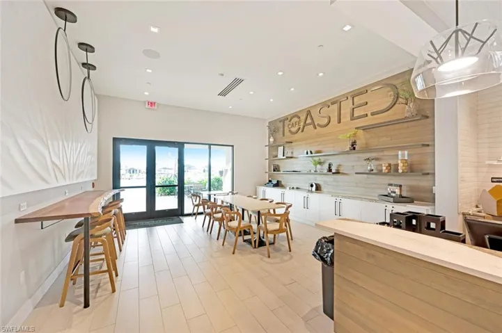 Dining area with light wood-type flooring and french doors