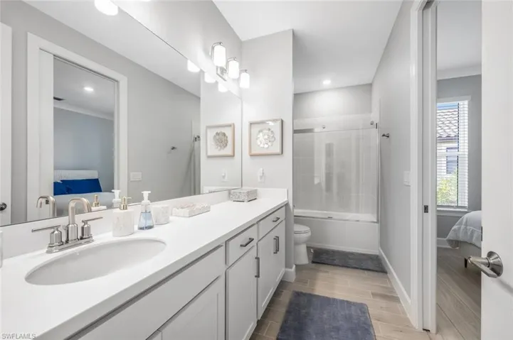 Full bathroom featuring shower / bathtub combination, toilet, and vanity