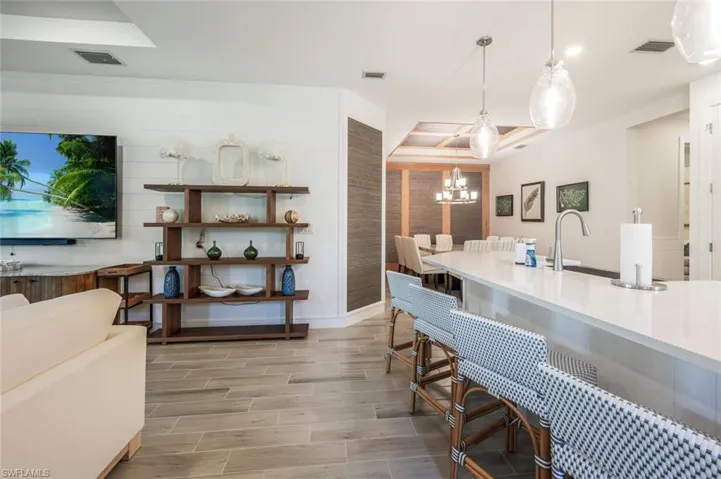 Kitchen with a chandelier and pendant lighting