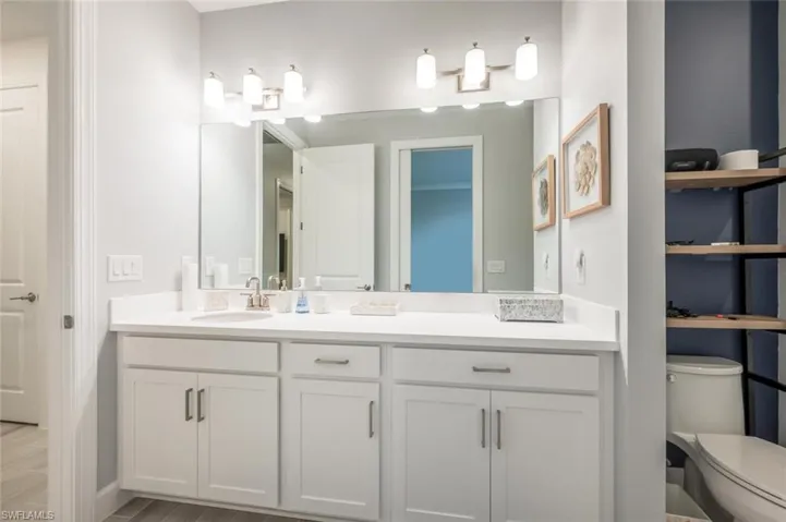 Bathroom featuring toilet and vanity