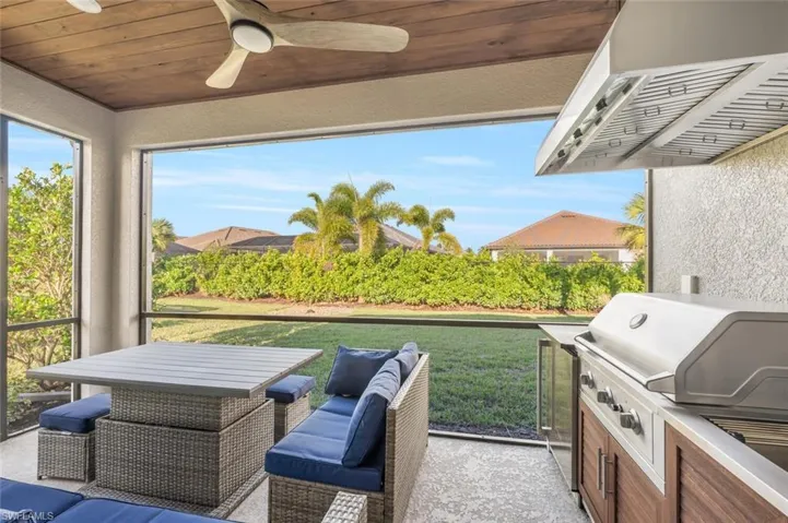 View of patio / terrace with ceiling fan and exterior kitchen
