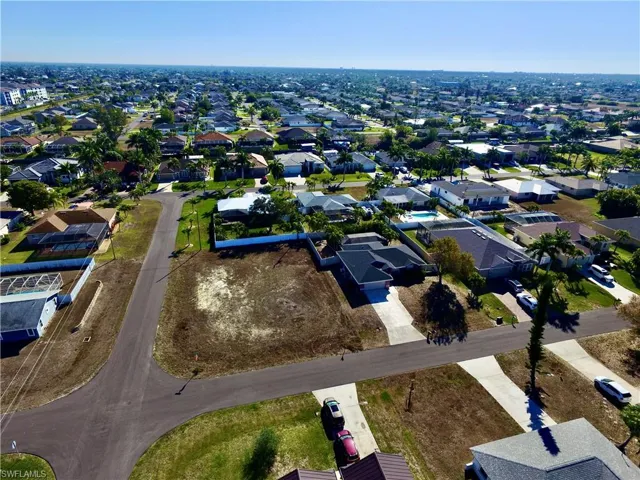 Aerial overview of property's location with nearby suburban area